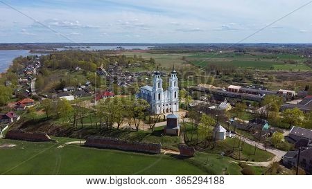 Aerial View Of The Roman Catholic Church In Ludza, Latvia. Sunny Spring Day