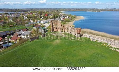 Aerial View Of The Ludza Medieval Castle Ruins On A Hill Between Big Ludza Lake And Small Ludza Lake