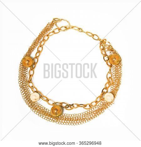 Women`s Wrist Bracelet Of Golden Chain And Beads On White 
Background. Top View