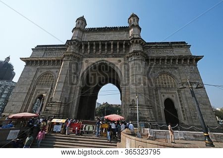 MUMBAI, INDIA - FEBRUARY 15, 2020: Gateway of India, monument commemorating the landing of King George V and Queen Mary in 1911, Mumbai, Maharashtra, India