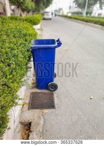 Blue Colored Dustbin At Roadside To Keep City Clean