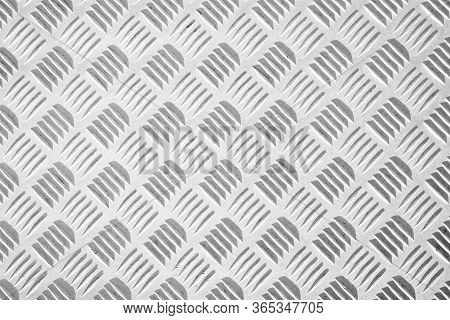 Steel Dirty And Used Checker Plate Metal Sheet. Can Be Use As Background Or Texture.
