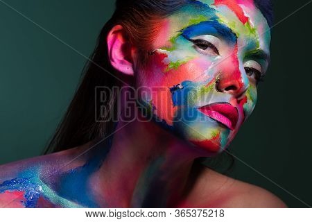Face Art And Body Art. Creative Makeup With Colorful Patterns On The Face. Modern Makeup Art, Bold S