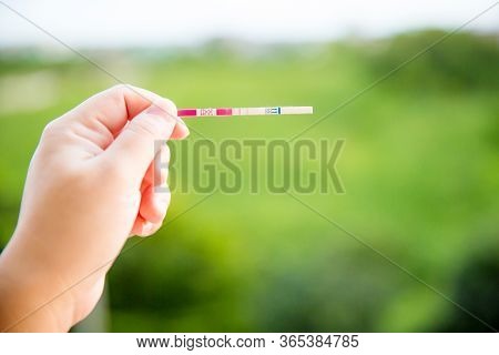 Positive Pregnancy Test On Strip. Baby Coming Soon Concept.