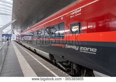 Feb 6, 2020 - Salzburg, Austria: Red Black Color Obb Railjet Train On The Platform At Railway Statio