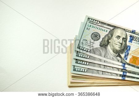 Money American Hundred Dollar Bills Pile Of Various Currencies Isolated On White Background. Closeup