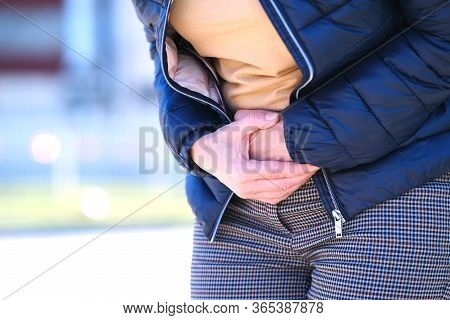 The Girl On The Street Felt A Twinge Of Pain In Her Stomach. Holding On With Both Hands To The Sore 