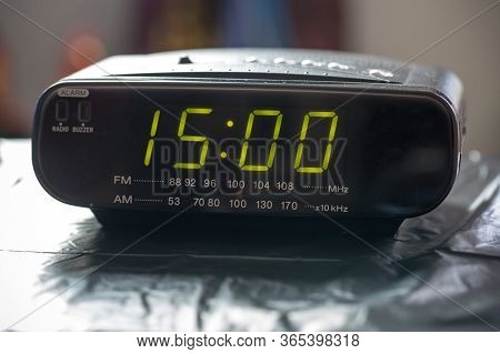 Black Digital Alarm Radio Clock.alarm Radio Clock Indicating Time To Wake Up. Digital Clock Closeup 