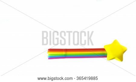 A Comet Of Seven Straws Of Rainbow Colors And A Star. Isolated Objects On A White Background. The Co