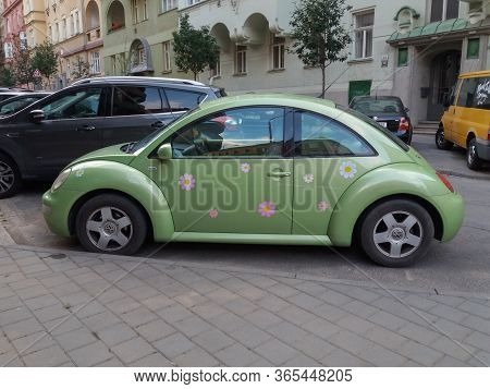 Brno, Czech Republic - Circa June 2018: Flower Power Green Volkswagen New Beetle Car