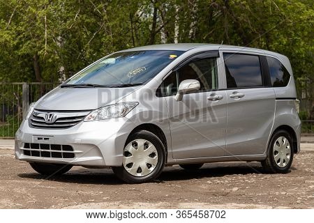 Novosibirsk/ Russia - May 02 2020: Honda Freed, Front View Of Modern Gray Hatchback Parked On Green 