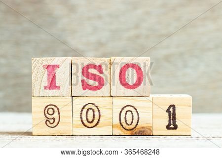 Alphabet Letter In Word Iso 9001 On Wood Background