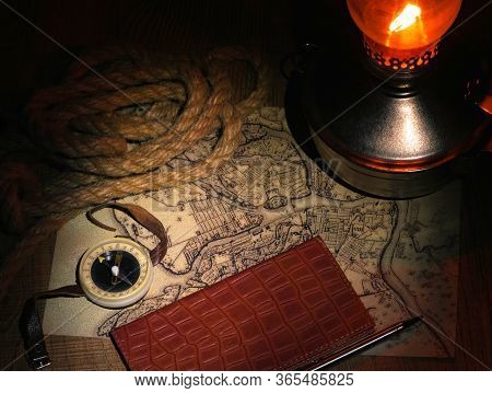 Preparation For Travel On An Old Map With A Compass A Dark Background
