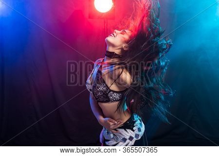 Portrait Of A Woman In Oriental Costume Performing Belly Dance. Tribal Fusion Dance Concept.