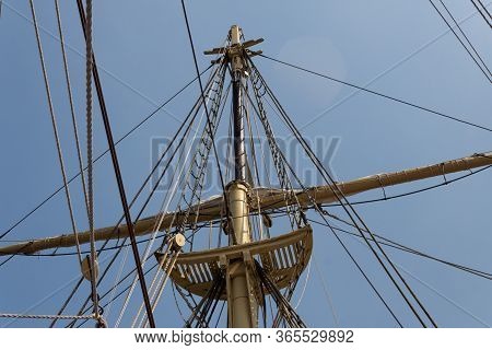 Block And Tackle, Rigging, And Shrouds Surrounding A Mast On A Vintage Tall Ship, Blue Sky, Marine T