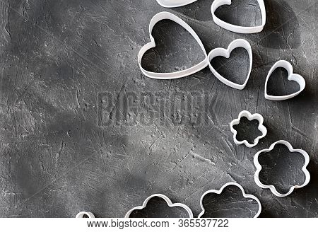 Cookie Cutters On Grey Background. Heart Shaped Cookie Cutters And Flower Shaped Cutter For Baking. 