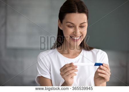 35s Woman Holding Pregnancy Test Saw Two Stripes Feels Happy