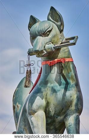 Kyoto / Japan - March 24, 2018: Statue Of A Kitsune, Japanese Shinto Red Fox God, In Fushimi Inari S