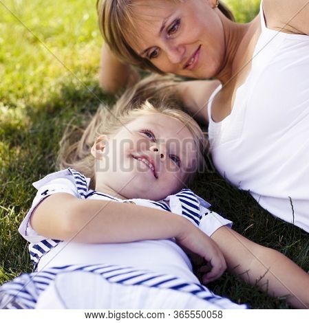 Little Girl With Mother Outside Walking At Playgarden, Lifestyle People Concept