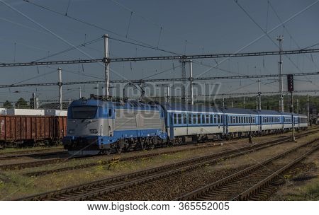 Blue Electric Engine With Passenger Coaches In Valasske Mezirici Station