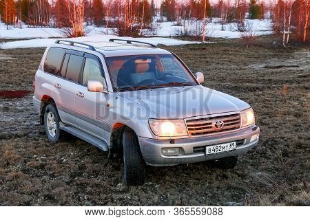 Novyy Urengoy, Russia - May 9, 2020: Grey 4x4 Vehicle Toyota Land Cruiser 100 In The Spring Tundra.