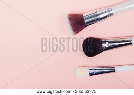Set Kit Makeup Brushes On Pink Background, Copy Space