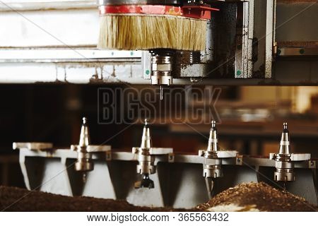 Machine With Numerical Control For Cutting Wood With Various Router Bits.