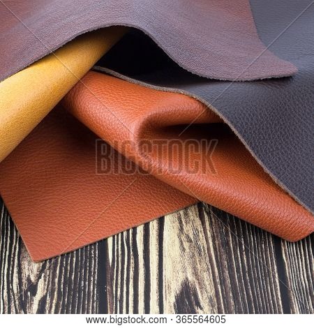 Different Colors Natural Leather Textures Samples On Dark Wooden 
Background