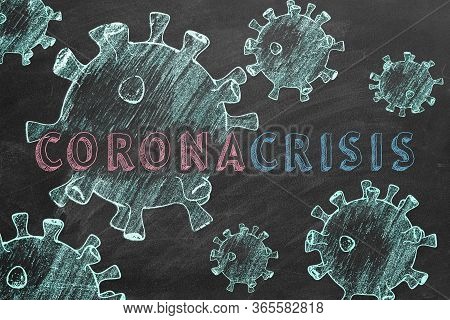 Text Coronacrisis And Coronavirus Cells Are Drawn With Chalk On A Blackboard.