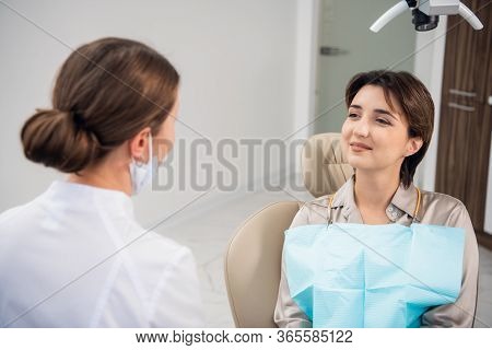 Closeup Of A Woman, Patient, At The Dentists Waiting To Be Chec