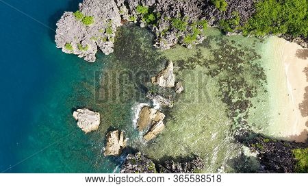 Tropical Beach With Tourists Surrounded By Blue Water, Aerial View. Lahos Island, Caramoan Islands, 