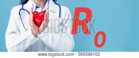 R Nought Theme With A Doctor Holding A Heart On A Blue Background