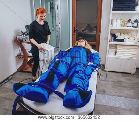 Pressotherapy Machine On Woman In Beauty Center