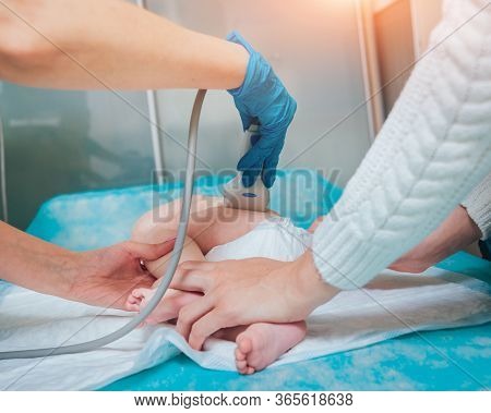 Doctor And Little Boy Patient. Ultrasound Equipment. Sonography. Hip Dysplasia
