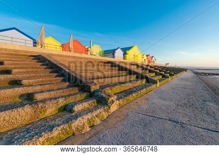 Colourful Kiosks And Buildings Line The Seafront Promenade At Prestatyn, North Wales.