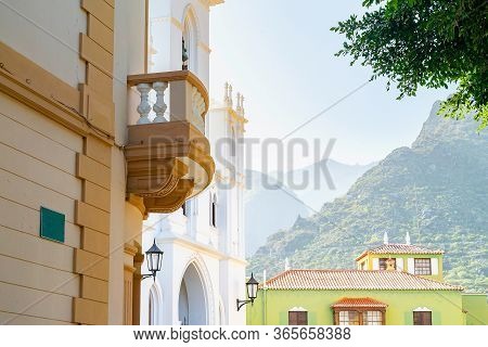 View To The Mountatins From The Street Of Town On Tenerife. Old Spanish Buildings With A Fogge Mount