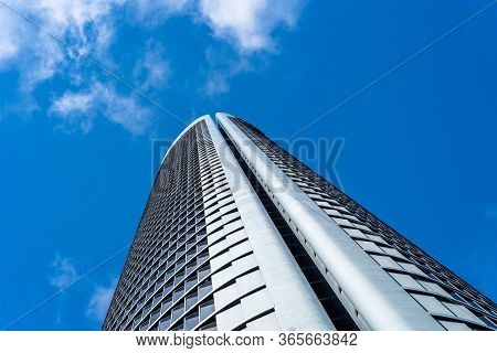 Madrid, Spain - May 10, 2020: Low Angle View Of Office Building In The City Of Madrid Against Blue S