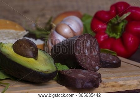 A Black Pudding An Avocado And Other Vegetables
