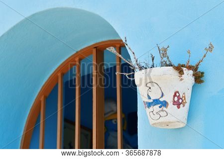 JUZCAR, SPAIN - MAY 22, 2019: Blue village of Juzcar street view in Spain.