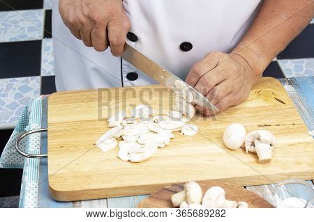 Chef Cut Mushrooms With A Knife  / Cooking Mushroom Cream Soup Concepti