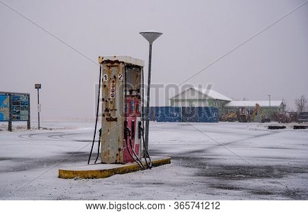 Fuelling Gas And Petrol Station On An Icy Road In Iceland During A Snow Storm In Spring