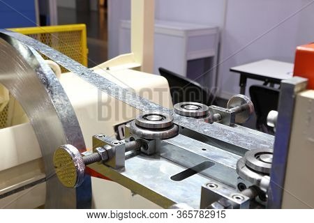 Stainless Steel Roll  Is Drown Into  Cold Roll  Machine ;  Engineering  Equipment Industrial Backgro