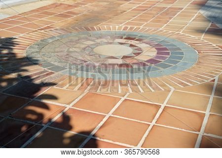 Outdoor Mosaic, Round Tiled Pattern On The Garden Floor.