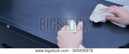 Young Woman Is Holding Spray Bottle, Rag To Clean, Wipe Down Office Metal Cabinet Shelf Accommodatio
