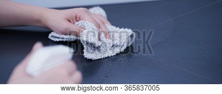Young Woman Is Holding Spray Bottle, Rag To Clean, Wipe Down Office Metal Cabinet Shelf Accommodatio