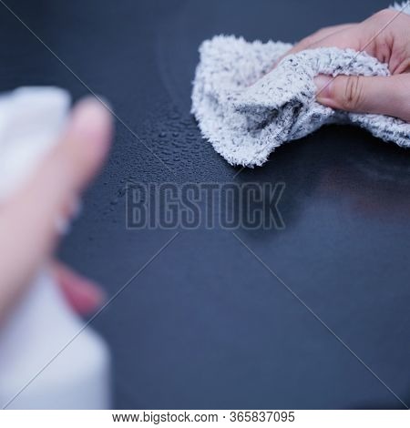 Young Woman Is Holding Spray Bottle, Rag To Clean, Wipe Down Office Metal Cabinet Shelf Accommodatio