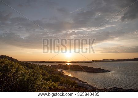 Sunset On Marstrand With Two Boats Laying In The Bay