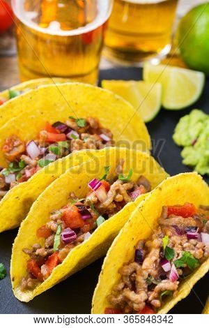 Taco Shell Nachos With Beef, Guacamole, Chili, Cheese Salsa, Tequila