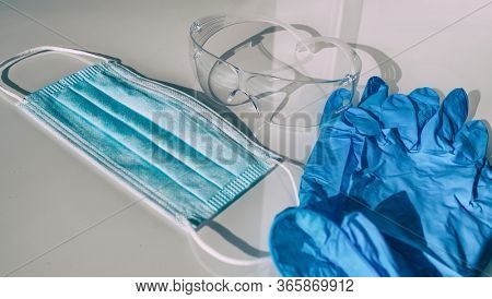 PPE COVID-19 Mask, gloves, protection glasses for healthcare workers. Shortage of personal protective equipment for coronavirus.