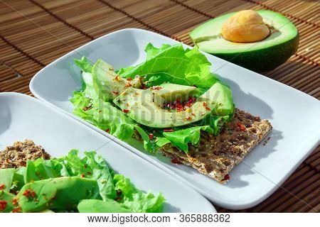Risp Sandwich With Avocado. Snack Bread And Fiber Food. Wheat Crisp Bread. Flat Lay